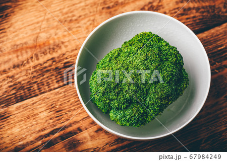 Fresh broccoli in white bowl 67984249