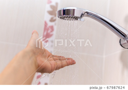 washing concept. Hygiene Man is checking a water washing concept. Hygiene Man is checking a water 67987624