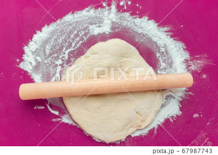 raw dough with flour, and food preparation. raw dough with flour, and food preparation. 67987743