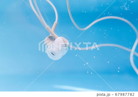 headphones listening to music in the water, under headphones listening to music in the water, under 67987782