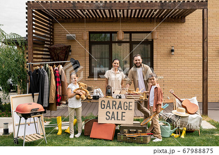 Friendly family selling stuff together 67988875