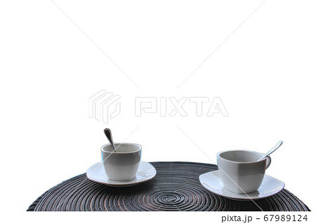 Two empty coffee cups with a spoon on the table 67989124