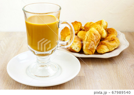 Milk coffee gluss cup and white plate of 67989540