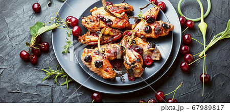 Chicken wings with cherries. Chicken wings with cherries. 67989817
