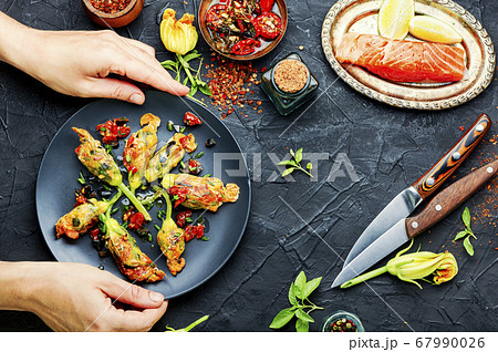 Fried zucchini flowers stuffed fish 67990026