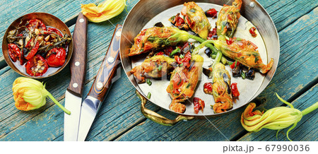 Fried zucchini flowers with filling. Fried zucchini flowers with filling. 67990036