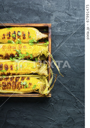 Grilled corn cobs Grilled corn cobs 67991475