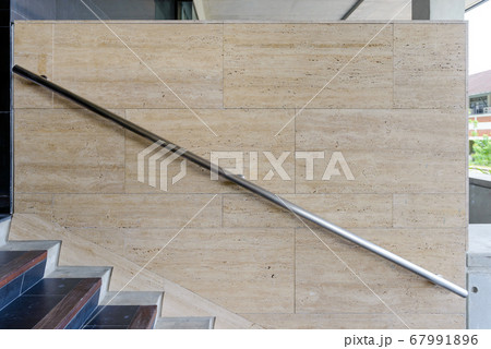 Modern stainless steel railing outside building. Modern stainless steel railing outside building. 67991896