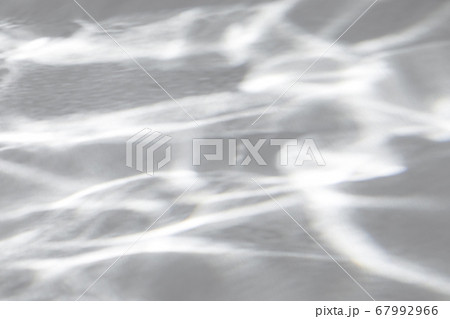 shadow and light caustic effect on a white wall shadow and light caustic effect on a white wall 67992966