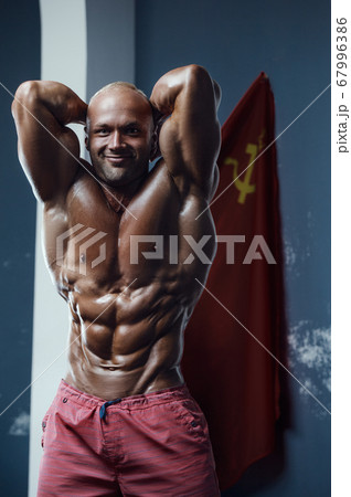 Bodybuilder athletic man workout muscles exercise 67996386
