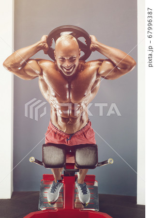 Bodybuilder athletic man workout muscles exercise Bodybuilder athletic man workout muscles exercise 67996387