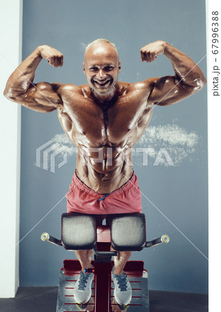 Bodybuilder athletic man workout muscles exercise. 67996388