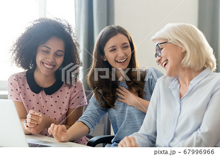 Diverse colleagues having fun during break, laughing businesswomen 67996966