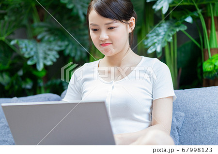 Woman using laptop Woman using laptop 67998123