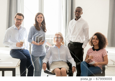 Portrait of happy smiling diverse employees team looking at camera 67999000