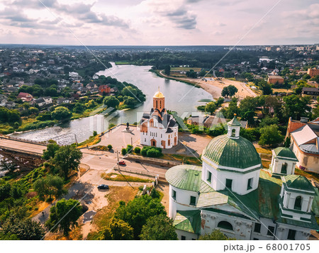 Aerial view of two old churches near river and Aerial view of two old churches near river and 68001705