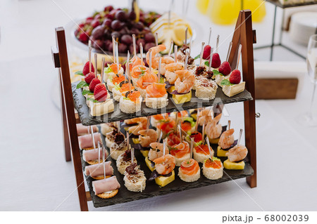 Different light snack appetizer on tray at the 68002039