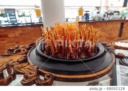 Bacon on bread sticks in glasses delicious Bacon on bread sticks in glasses delicious 68002128