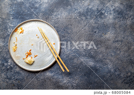 Empty dirty dish after korean kimchi with chopstick Empty dirty dish after korean kimchi with chopstick 68005084