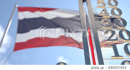 30 degrees centigrade on a thermometer measuring air temperature near flag of Thailand. Hot weather forecast related 3D rendering 68005403