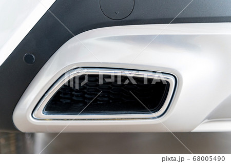 Exhaust pipe of a modern white car 68005490