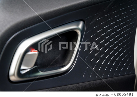 Modern chrome inner car door handle close Modern chrome inner car door handle close 68005491