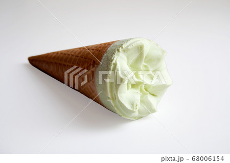 Pistachio ice cream cone isolated on white background Pistachio ice cream cone isolated on white background 68006154