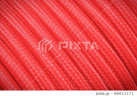 Red electric cable as background texture 68011171