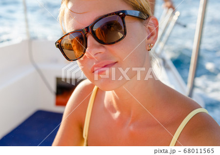 Red woman on a yacht cruise Red woman on a yacht cruise 68011565