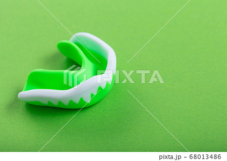 one green kappa on a green background, tooth one green kappa on a green background, tooth 68013486