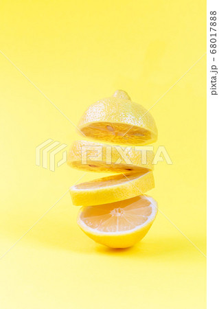 Levitation of lemon slices on a yellow background 68017888