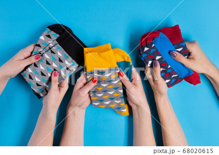 three pairs of female hands hold three pairs of three pairs of female hands hold three pairs of 68020615