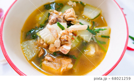 Tom yam chicken and hatched marinade in a tableware bowl. 68021259