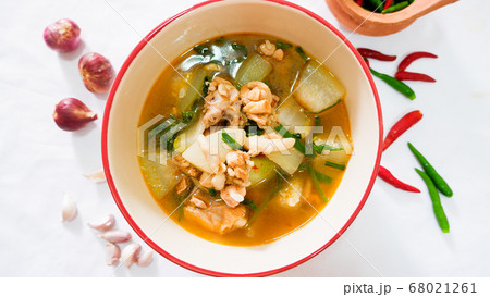 Tom yam chicken and hatched marinade in a tableware bowl. 68021261
