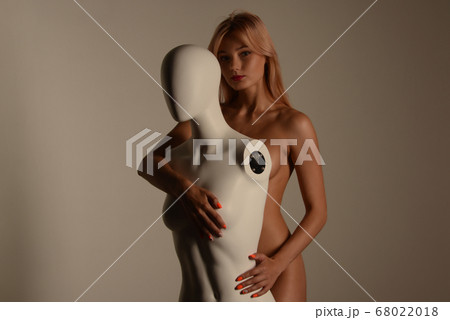 Beautiful young nude woman with mannequin posing Beautiful young nude woman with mannequin posing 68022018