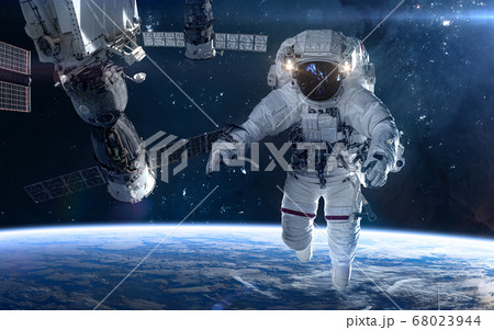 Astronaut, space station in deep space. Beautiful cosmic landscape Astronaut, space station in deep space. Beautiful cosmic landscape 68023944