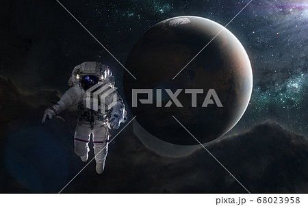 Astronaut and red planet in blue rays. Mars, Solar System 68023958