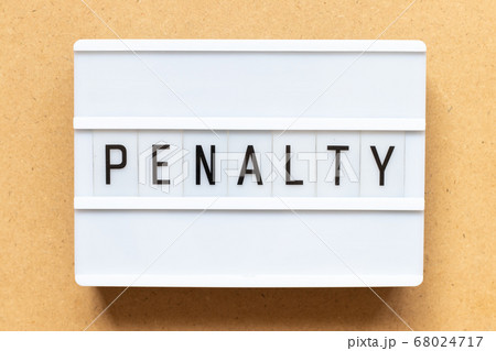 Lightbox with word penalty on wood background 68024717