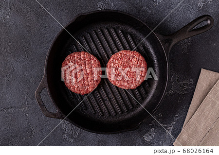 Fresh raw minced homemade grill beef burgers in a 68026164