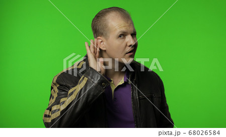 Confused rocker man having hearing problems,...の写真素材 [68026584] - PIXTA