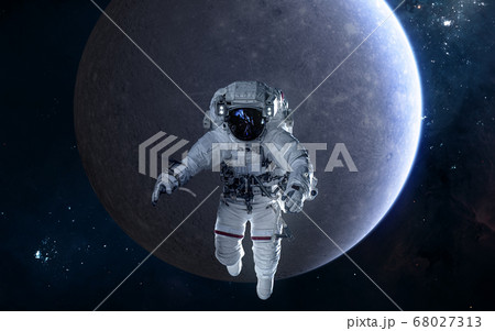 Astronaut on background of Mercury. Solar system Astronaut on background of Mercury. Solar system 68027313