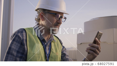 Engineer having a video call Engineer having a video call 68027591