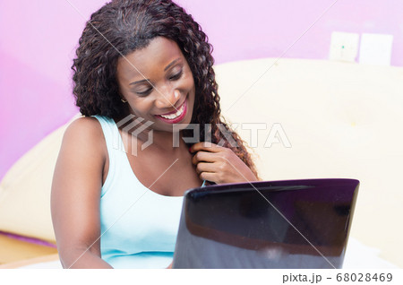 happy young woman using a laptop. happy young woman using a laptop. 68028469