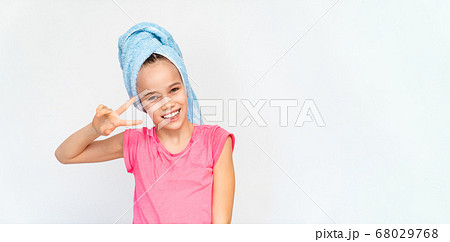 smiling girl in blue towel and pink t-shirt. smiling girl in blue towel and pink t-shirt. 68029768