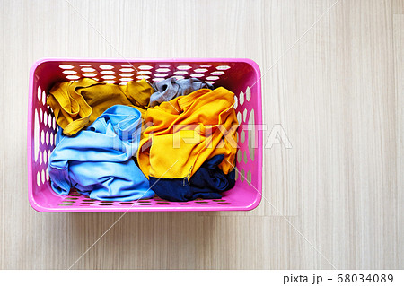 Clothes in pink plastic laundry basket. Laundry Clothes in pink plastic laundry basket. Laundry 68034089