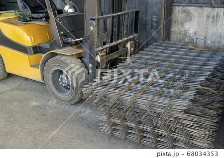 forklift carrying a stack of rebar mesh forklift carrying a stack of rebar mesh 68034353