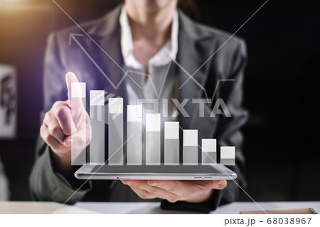 Business documents on the desk with a notebook and business graph graph with office icons in the morning.  68038967