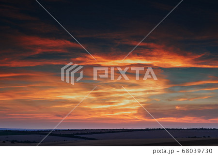 wheat field in a beautiful sunset, sunlight and wheat field in a beautiful sunset, sunlight and 68039730