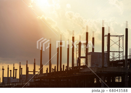 Silhouette of construction worker working on site 68043588