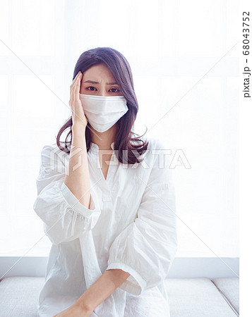 Asian woman having headache on white background 68043752